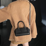 NAMCOVERSE 2025Niche design retro simple vegetable tanned cowhide long handle underarm baguette bag sugar triangle underarm bag shoulder women's bag