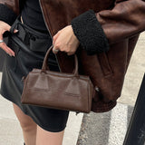 NAMCOVERSE 2025Niche design retro simple vegetable tanned cowhide long handle underarm baguette bag sugar triangle underarm bag shoulder women's bag