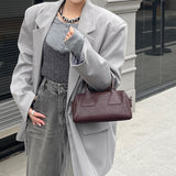 NAMCOVERSE 2025Niche design retro simple vegetable tanned cowhide long handle underarm baguette bag sugar triangle underarm bag shoulder women's bag