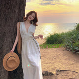 2025 Seaside vacation dress women's atmosphere pure desire hottie deep V-neck niche sexy backless strap perspective dress
