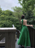 2025 green V-neck neck suspender dress women's summer seaside vacation high-end temperament backless long skirt