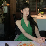 2025 green V-neck neck suspender dress women's summer seaside vacation high-end temperament backless long skirt